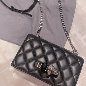 Black Alexander McQueen jeweled knuckle bag
